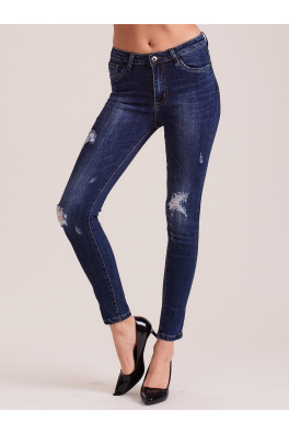 Ciemnoniebieskie dopasowane jeansy damskie